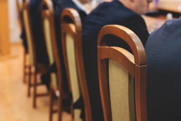 Group of men in business suits talking and discussing at conference, politicians and entrepreneurs...