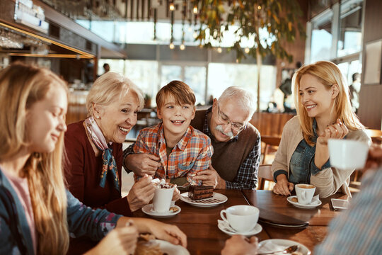 Multi Generational Family Enjoying a Sweet Moment at a Cafe