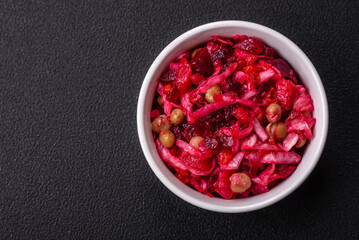 Delicious juicy vinigret salad of boiled vegetables potatoes, beets, pot, cabbage and carrots