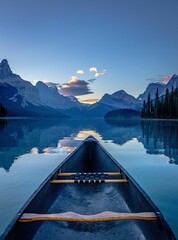 the view from a canoe looking out into the lake at sunset