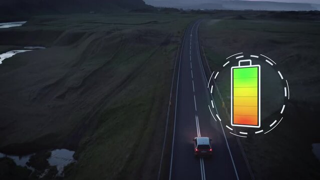 Forwards tracking of car driving on road in amazing countryside at dusk. Augmented reality representing battery state of charge. Emobility a ecology. Iceland