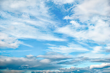 Cloudscape. Blue sky with white and gray clouds. Firmament on an overcast day. Natural background....