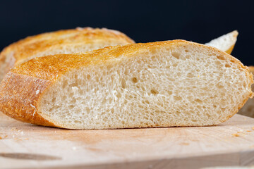 wheat loaf of bread close-up on the table