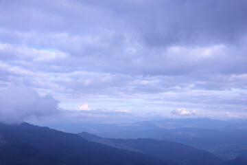 Morning view from the Dragobrat mountain peaks in Carpathian mountains, Ukraine. Cloudy and foggy landscape around Drahobrat Peaks in early morning