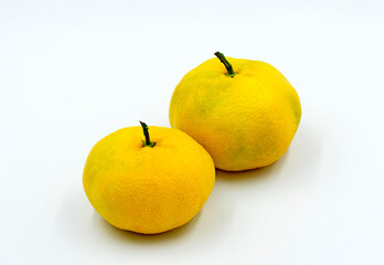 Two fresh thin skinned juicy seedless mandarins 