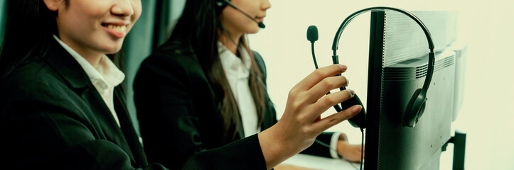 Business people wearing headset working in office to support remote customer or colleague. Call...
