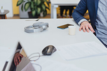 Multicultural colleagues collaborate for company growth in modern, productive office space....