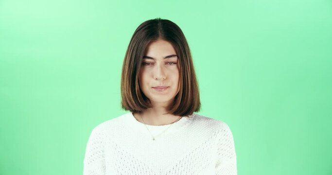 Green screen, face and serious woman in studio with breathing, control or neutral expression. Stare, portrait or female model with passive aggressive body language, curious or watching while isolated