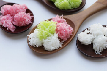 Sweet coconut balls, crispy coconut candies (Maprao Gaew). Thai traditional dessert