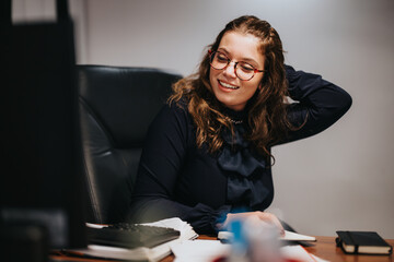 A couple strategizing in an office, discussing business growth and product development. Young...