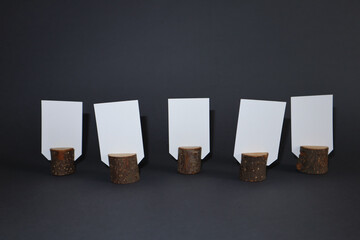 White empty cards with copy space in natural wooden stump.