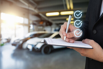 Concept of filling out car insurance in a garage.