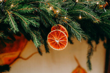 Christmas fir tree decorations with red and gold baubles. New Year celebration concept. Copy space.