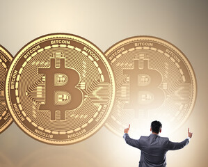 Businessman walking towards bitcoins in cryptocurrency blockchai