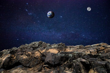 rock in space over earth and moon - obrazy, fototapety, plakaty