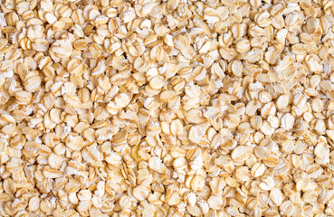 Heap of dry rolled oats isolated