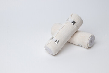 Medical bandage rolls, bandage, elastic , scotch tape, first aid supplies, a white background.
