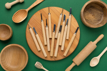 Carpenter tools with wooden objects on color background,top view