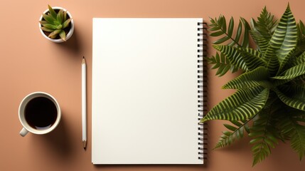 Naklejka na ściany i meble Blank notebook with pencil and plants on desk.