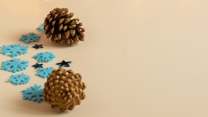 New Year cones and blue snowflakes on a light background