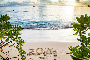 2024 written in sand on a tropical island - obrazy, fototapety, plakaty