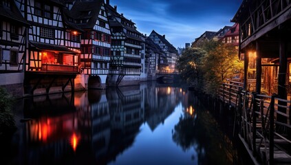 Evening Hues: Reflections of Half-Timbered Houses in Colmar France - obrazy, fototapety, plakaty