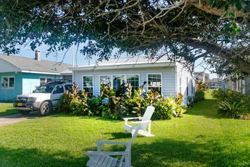 Nice oceanic style house with palm tree and lawn near the Atlantic Ocean.