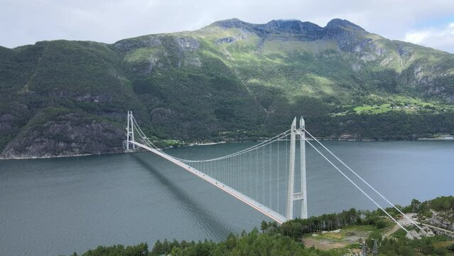 Aerial drone over the fjord and bridge in Norway on a cloudy - Hardanger Bridge