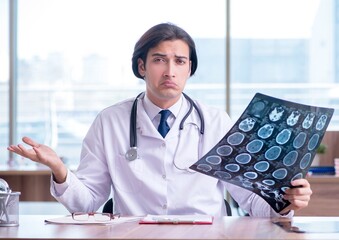 Young male doctor radiologist working in the clinic
