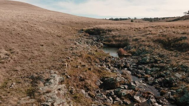 landscape grassy bare baron plains mountains