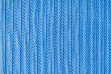 Jersey textile background , blue striped knitted fabric. Woolen knitwear, sweater, pullover surface...