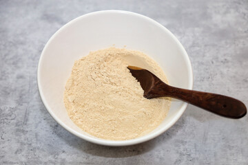 Organic oat fiber in a white bowl, normally used for low carb baking. 