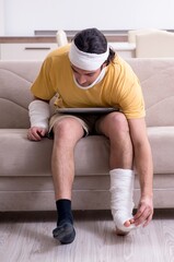 Fototapeta premium Young man after accident recovering at home