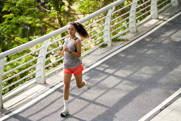 young asian woman running jogging outdoors