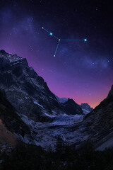Cancer constellation in starry sky over mountains at night