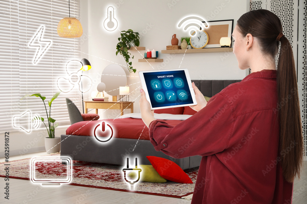 Poster woman using smart home control system via application on tablet indoors. different icons connected w