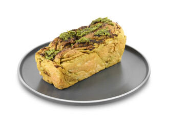 Plate with freshly baked pesto bread isolated on white