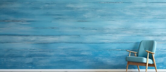 From afar, the abstract design on the beach house wall boasted a vintage wood texture, constructed with care to evoke a retro feel, blending grunge and paint to create a captivating blue color; this