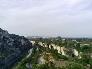 Fototapeta na wymiar Drone photo of a limestone mining in Setigi, Gresik, Indonesia
