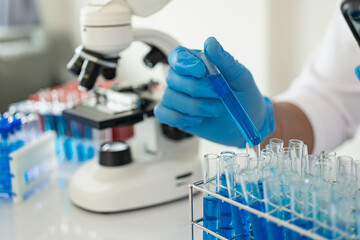 Healthcare researchers working in life science laboratories also work. Microscopes and test tubes:...