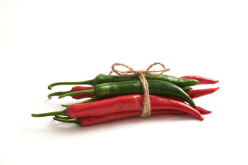 Red chilis and green chilis isolated on white background. Concept of strength through unity, where different elements come together to create a powerful and harmonious whole.