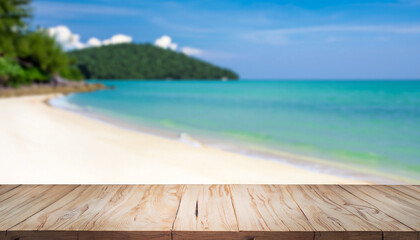 Wood table top on blurred blue sea and white sand beach background - can be used for display or montage your products