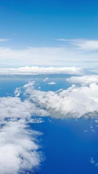 Aerial HD vertical video footage of clouds and blue skies flying above the islands of Hawaii USA