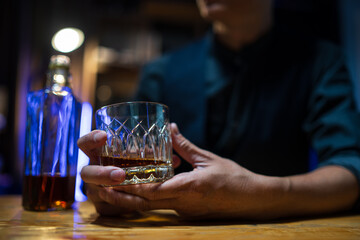 Barman pouring whiskey whiskey glass..