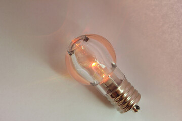  mini light bulb isolated on white background. orange color lighting.