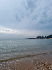 It is a beach with a mountain view.