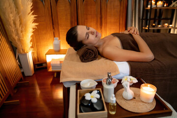 Caucasian woman customer enjoying relaxing anti-stress spa massage and pampering with beauty skin...