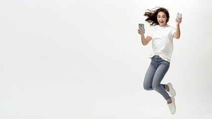 Woman hold smartphone and jumping with happiness, an online shopping, Winner.