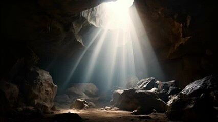 Concept photo of a dark and gloomy cave, representing the eleventh station Jesus is nailed to the cross. A single ray of sunlight breaks through the clouds and illuminates the spot where