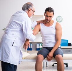 Fototapeta premium Young male patient visiting experienced doctor